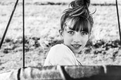 Portrait of girl on swing 