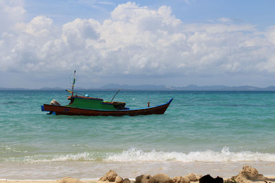 Boat in sea against sky