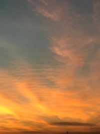 Low angle view of dramatic sky during sunset