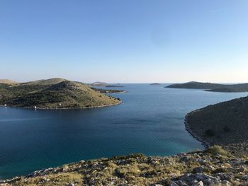 Scenic view of sea against clear blue sky