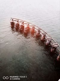 High angle view of wooden post in river