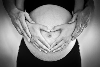 Close-up of hands touching baby