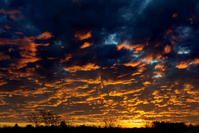 Low angle view of dramatic sky during sunset