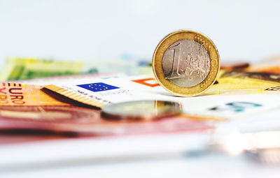 Close-up of coins on white background