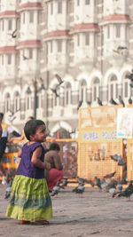 Full length of woman standing in city