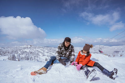 Man skiing on snow covered landscape