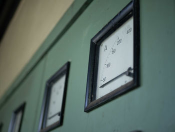 Close-up of clock on wall