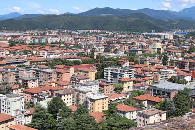 High angle view of townscape against mountains