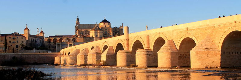 The roman bridge of córdoba, in spain, and the guadalquivir river. 