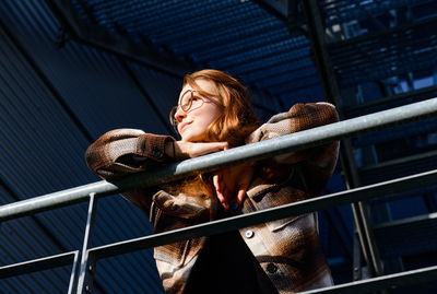 Side view of young woman looking away