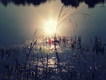 Scenic view of lake against sky during sunset