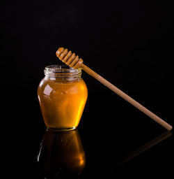 Close-up of jar against black background