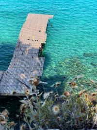 High angle view of pier amidst sea