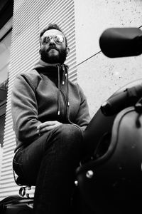 Portrait of man sitting outdoors