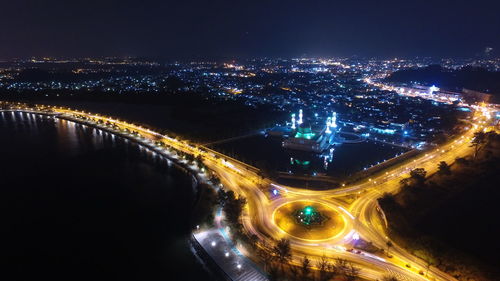 High angle view of light trails on road in city at night