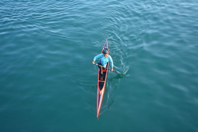 High angle view of man fishing in sea