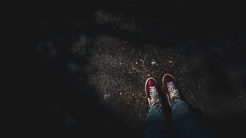 Low section of person standing on flooring