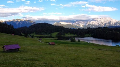 Scenic view of landscape and mountains against sky