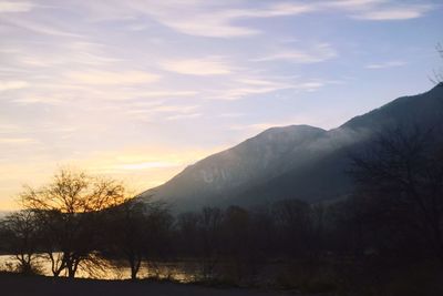 Scenic view of mountains against sky at sunset