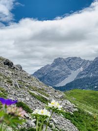 Scenic view of mountains against cloudy sky