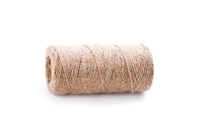 Close-up of thread against white background