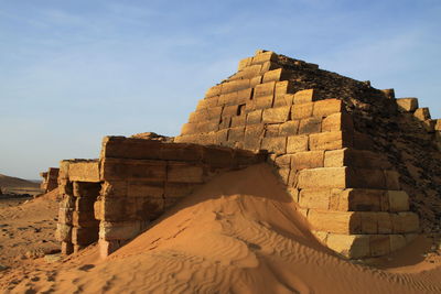 Low angle view of old ruin building against sky