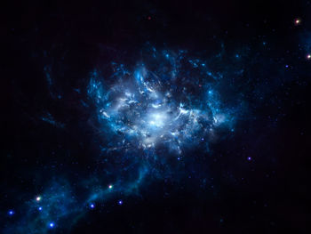 Low angle view of fireworks against star field at night