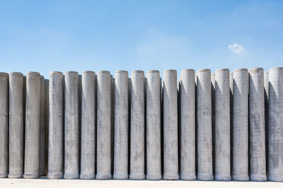 Concrete pipes against blue sky