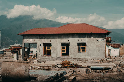 Exterior of old building by mountains against sky
