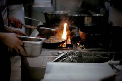 Midsection of man preparing food