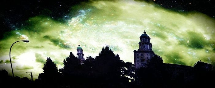 Low angle view of built structure against cloudy sky