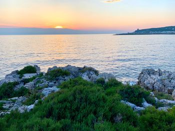 Scenic view of sea against sky during sunset