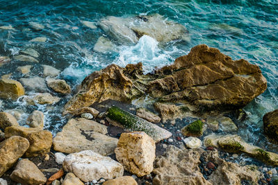 High angle view of rocks in sea