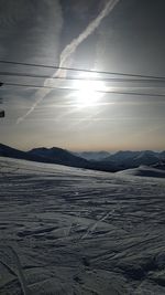 Scenic view of snowcapped mountains against sky during sunset
