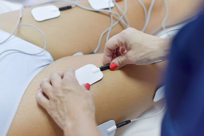 Midsection of woman holding hands