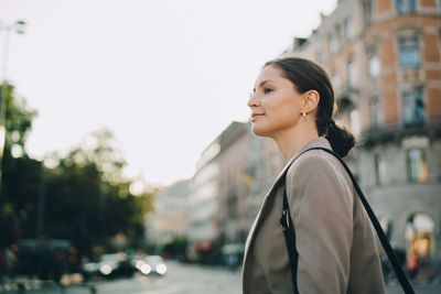 Woman looking away during city exploration