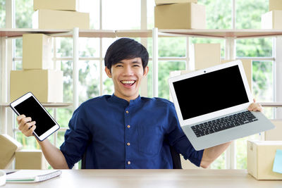 Portrait of young man using smart phone