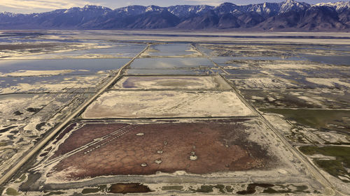 High angle view of salt flats against mountains