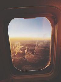 Aerial view of cityscape seen through airplane window