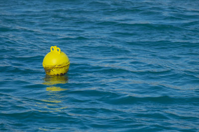 Yellow umbrella in sea