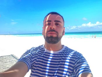 Portrait of young man on beach