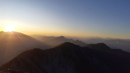 Scenic view of mountains against sky during sunset