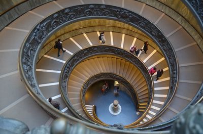 High angle view of people walking in spiral staircase in vatican museums