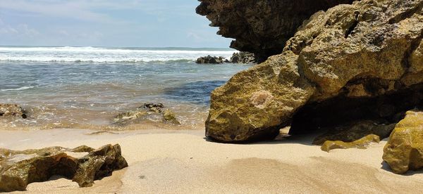 Reef in the wavy beach in blitar indonesia