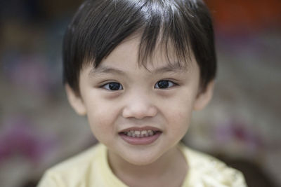 Close-up portrait of smiling boy