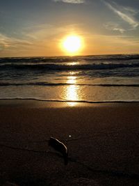 Scenic view of sea against sky at sunset