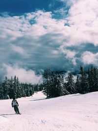 Scenic view of landscape against cloudy sky