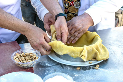 Midsection of man preparing food