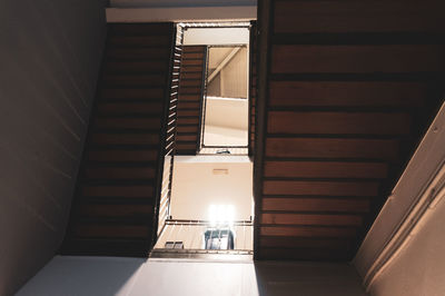 Low angle view of illuminated staircase in building