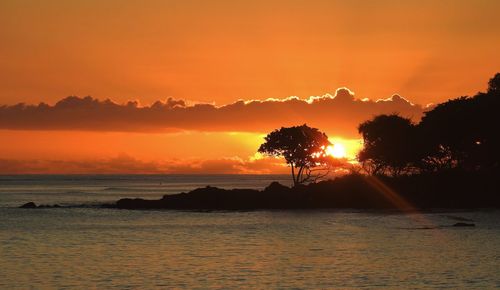 Scenic view of sea against romantic sky at sunset